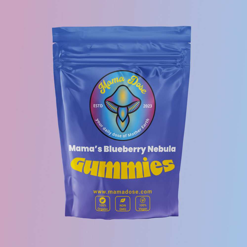 A blue package of "Mama's Blueberry Mind Expanding Gummies 300mg" with a logo and labels showing organic, non-GMO, and vegan features. The background transitions from pink to blue.