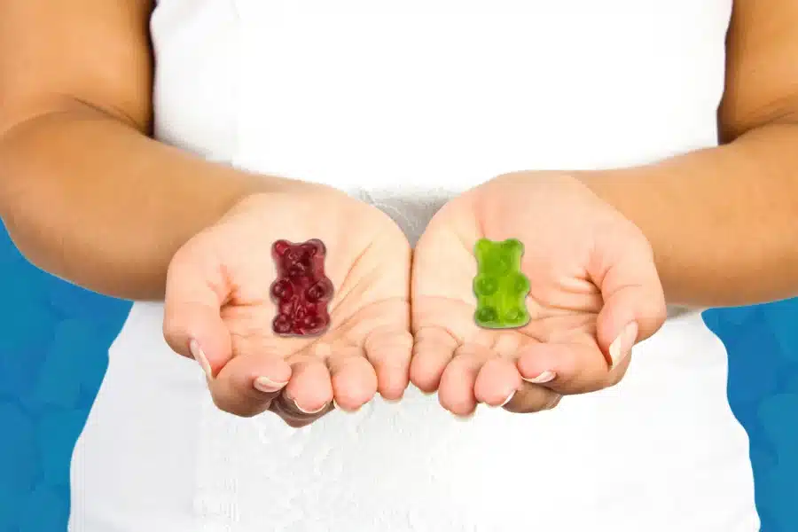 a woman holding psilocybin and thc gummies in each hand