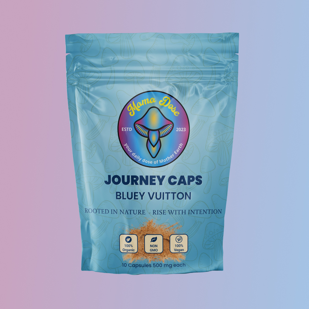 A resealable pouch labeled "Journey Caps Bluey Vuitton Strain" by Mama Dose, containing 10 vegan 500mg capsules, is shown against a blue and pink gradient background.