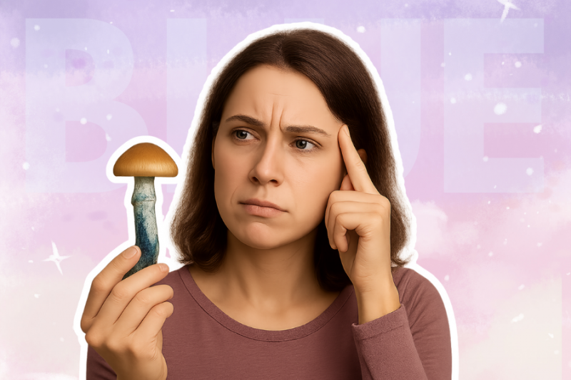 woman holding a blue-bruised mushroom and looking puzzled, with a thoughtful expression on her face, representing the question "why do magic mushrooms turn blue
